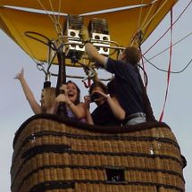 family in flying hot air balloon