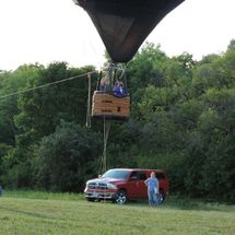 car next to balloon