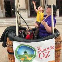 child with woman in hot air balloon